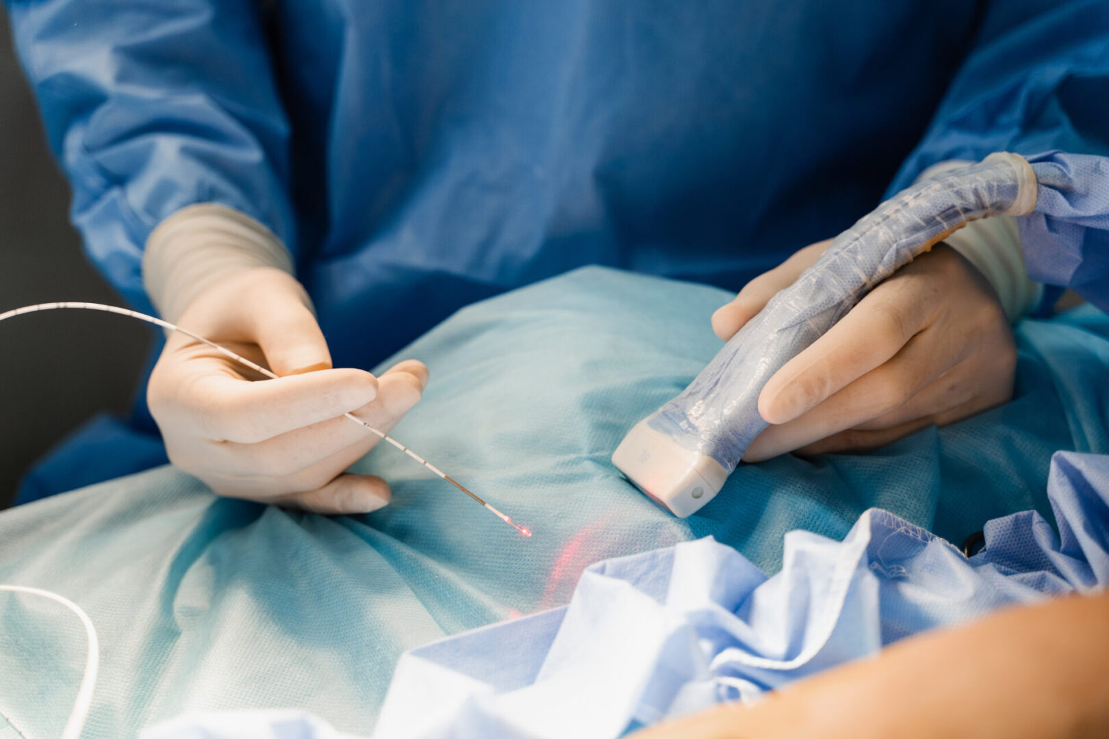 A surgeon is working on an implant.